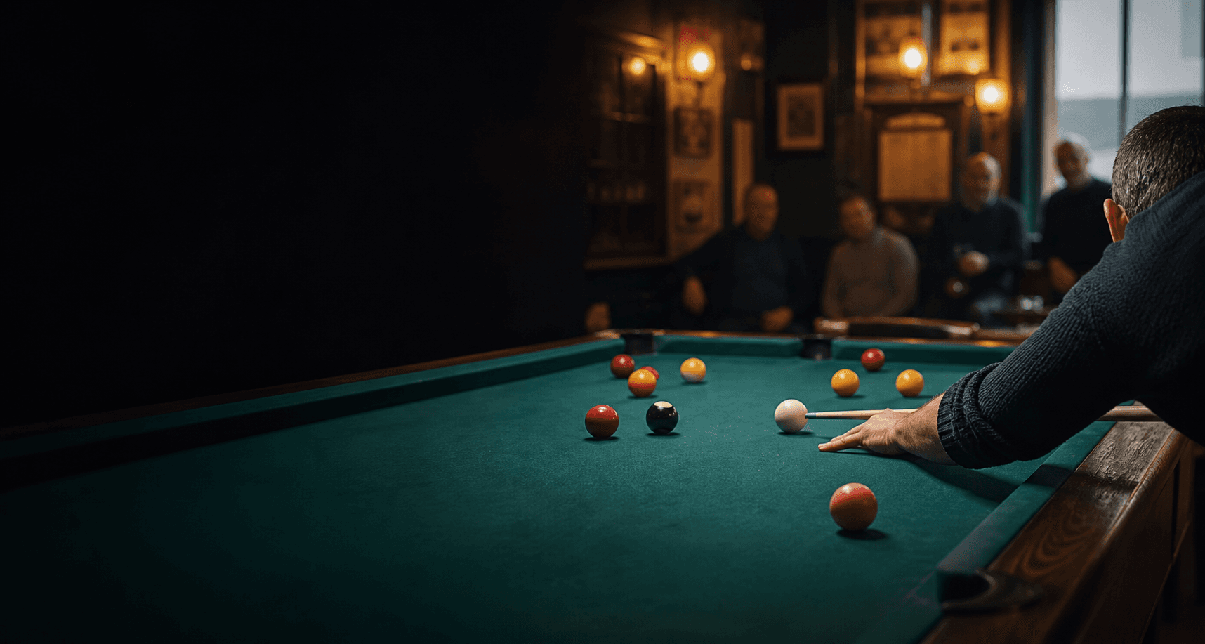 A player lining up a shot at a pool table in a local club